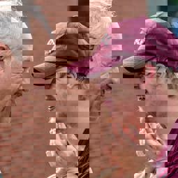 smiling older man and smiling man with Down syndrome