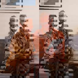 A man and a woman looking at a tablet together,