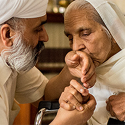 older couple, man holding woman's hand