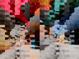 Hands on top of each other in a circle